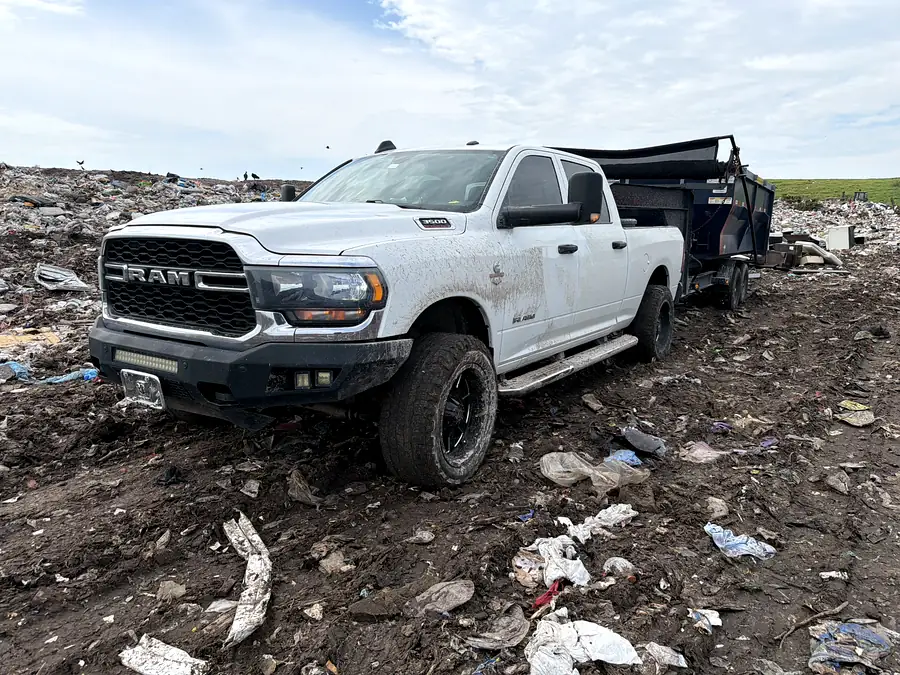 The truck and trailer at the landfill tipping face