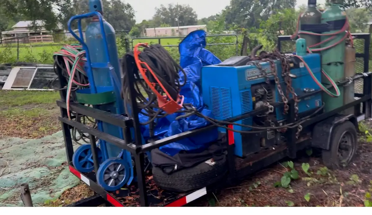 The Miller Bobcat welder and generator trailer with oxygen and gas bottles
